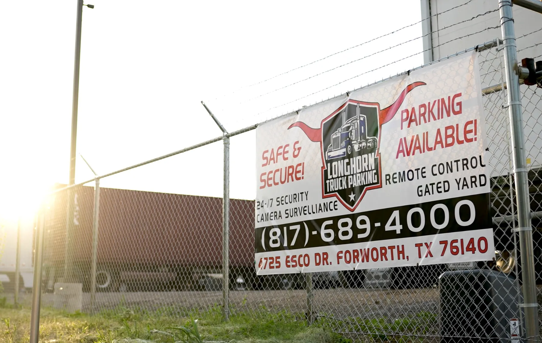 Longhorn Truck Parking gate sign at the Fort Worth lot on Esco Dr