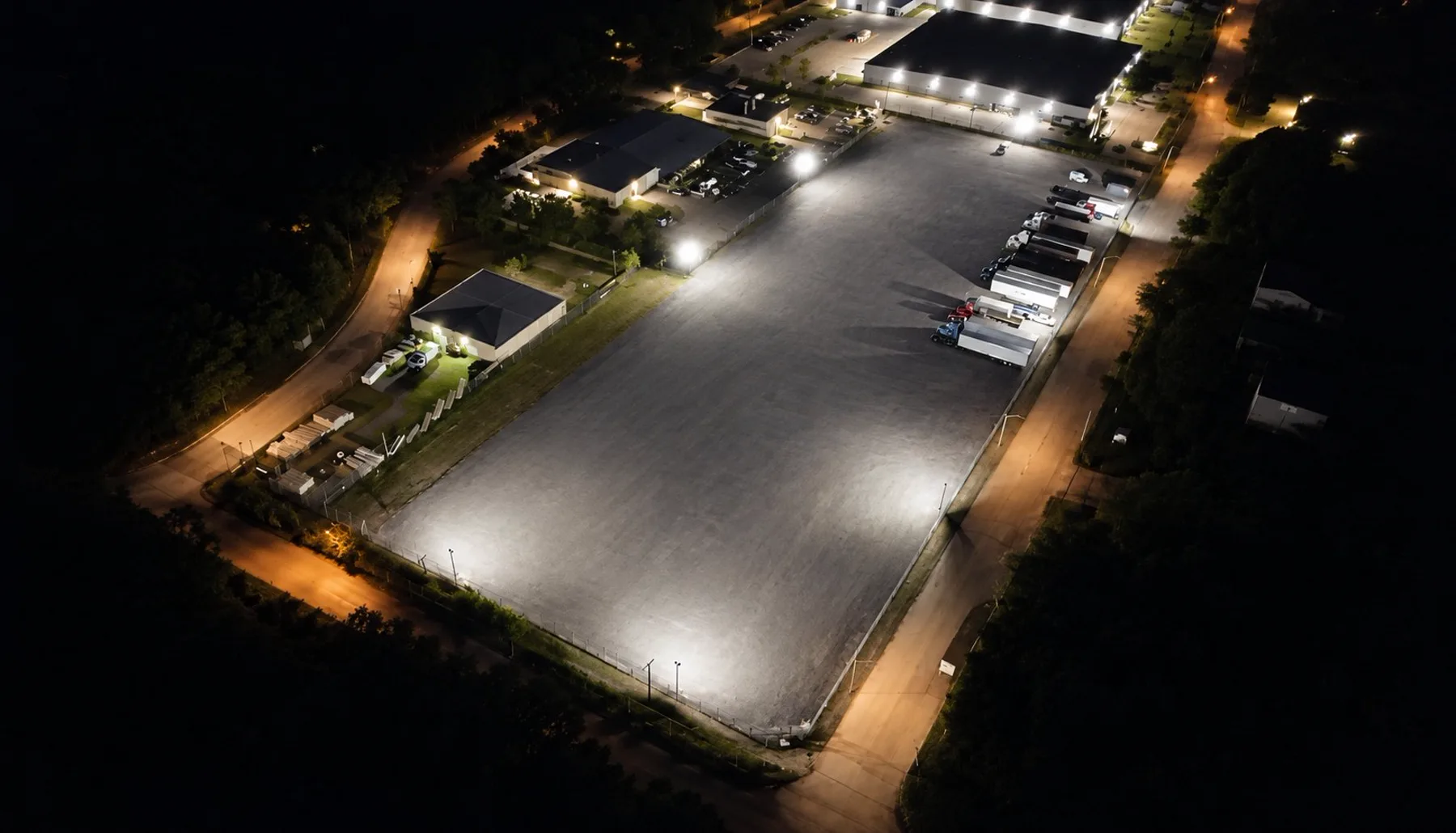 Aerial night view of the floodlit Longhorn truck parking lot